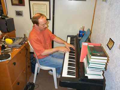 David Denniston at the piano in Anne LeBaron's studio